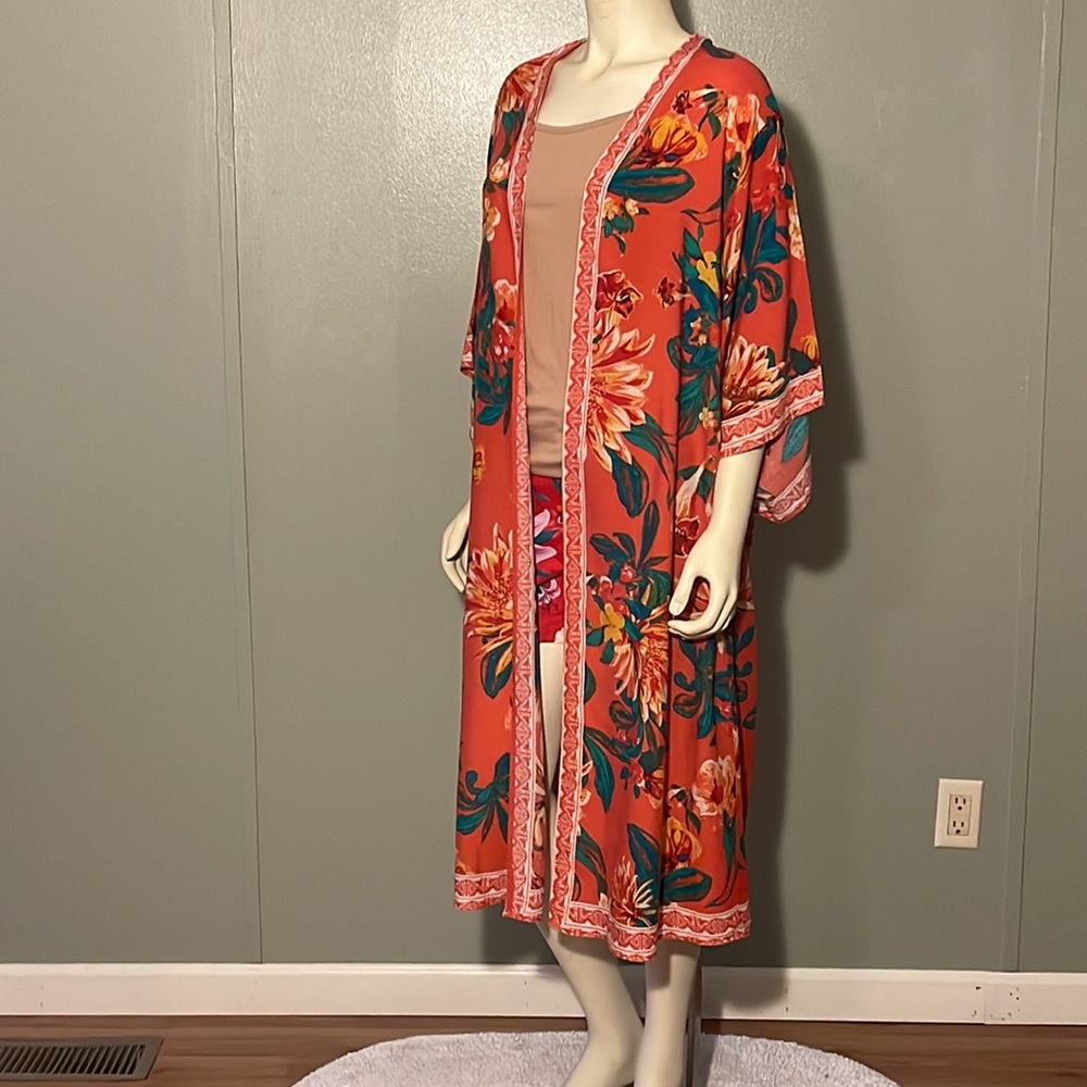 Flying tomato, floral cover-up.